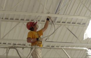 Man painting the ceiling